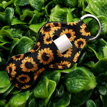 Load image into Gallery viewer, SunKeeper || Black w/Sunflowers || Custom Sunflower Keyring Balm Holder || Neoprene Keychain