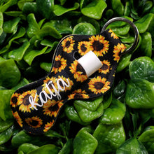 Load image into Gallery viewer, SunKeeper || Black w/Sunflowers || Custom Sunflower Keyring Balm Holder || Neoprene Keychain